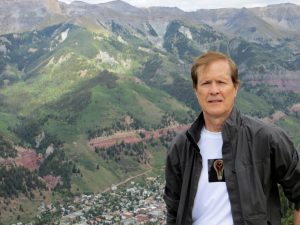 Author and Boomer expert Brent Green standing above Telluride, Colorado